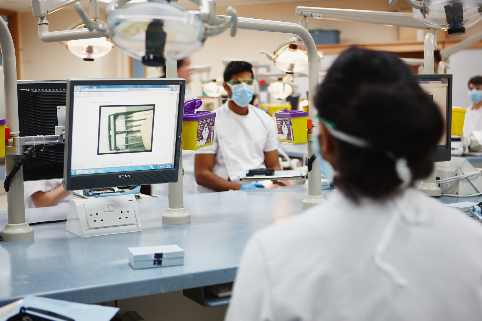 Dental students sat in front of computer screens