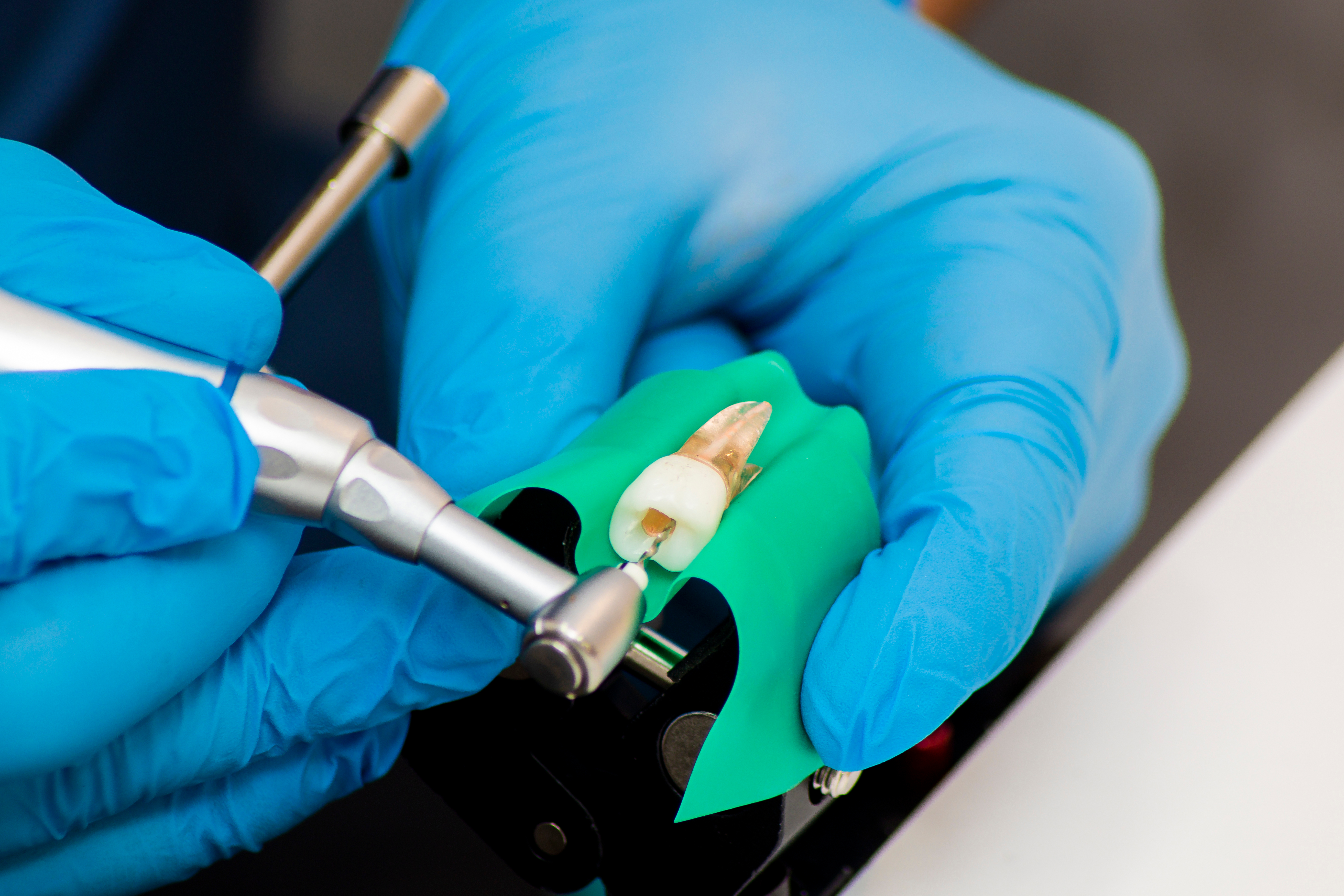 Close up of dental professional holding dental tools