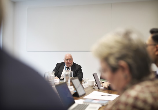 Image of a person sitting at a table