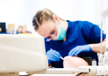 Dentist with tools