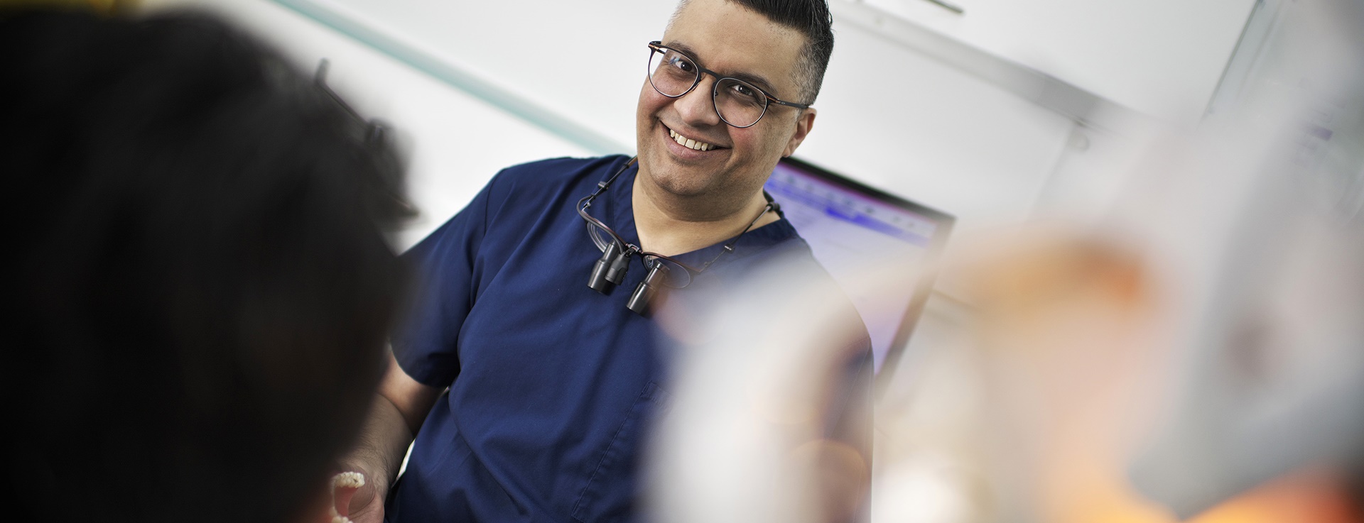 Male dentist smiling in practice