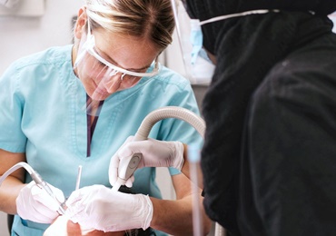 Dentist with tools