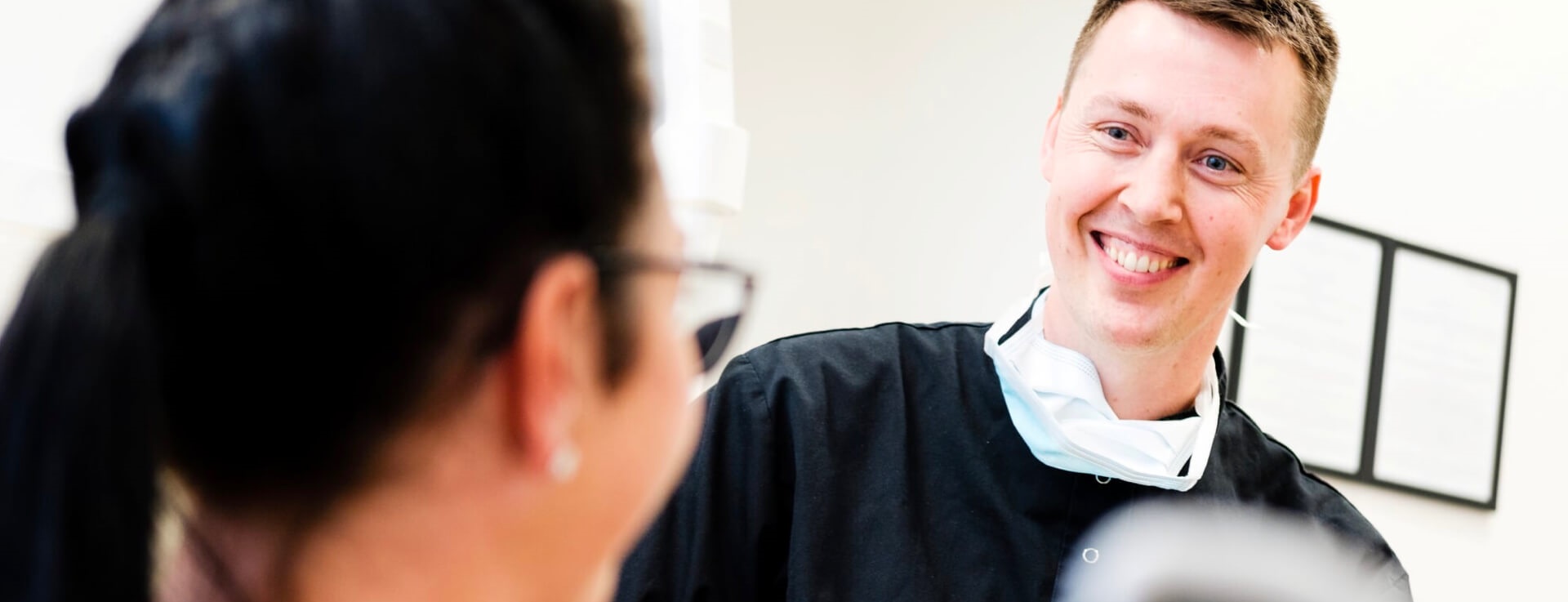 Dentist smiling at patient